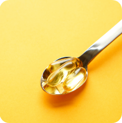 omega supplements on a spoon