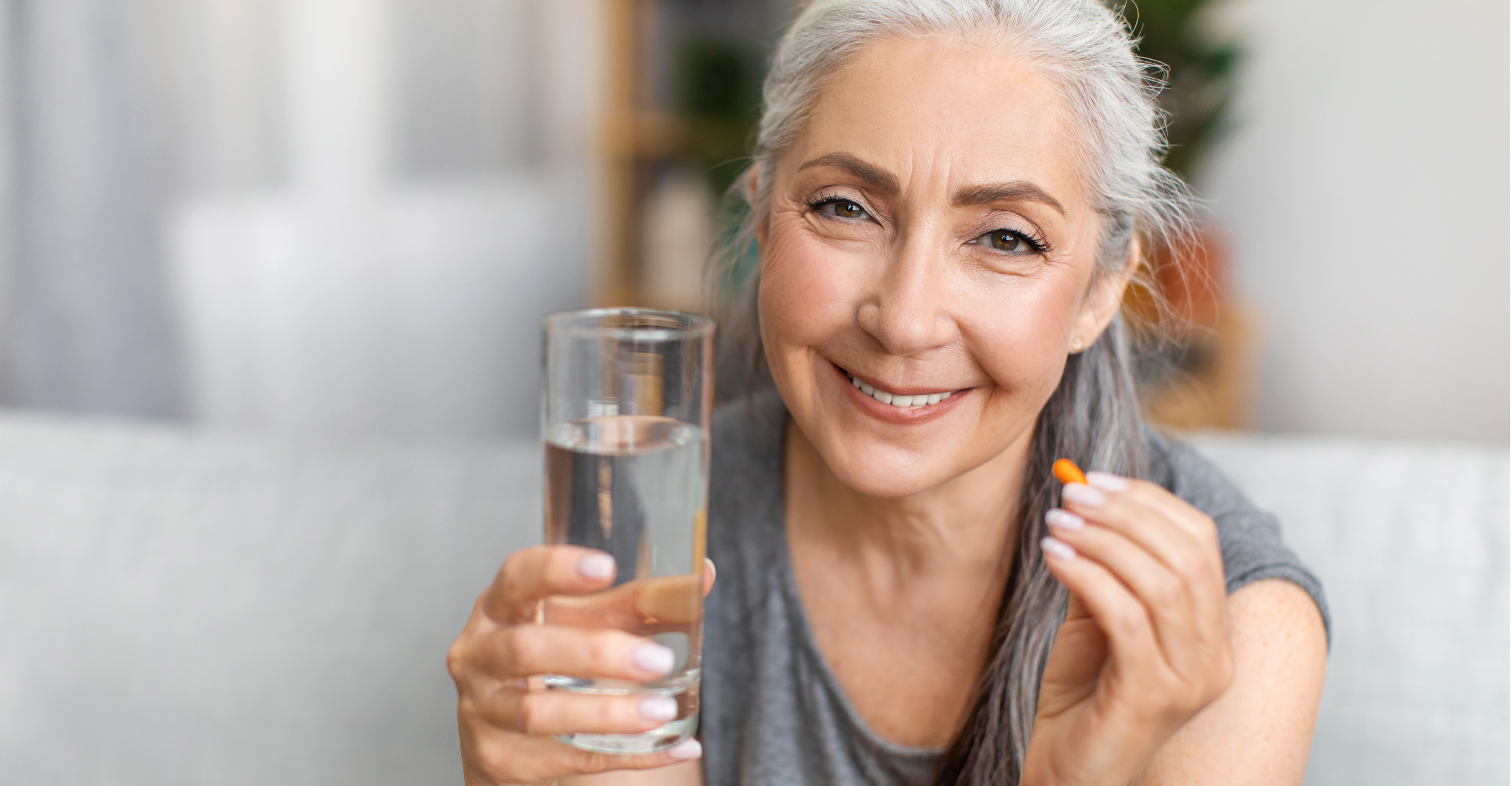 woman taking an omega-3 supplement 