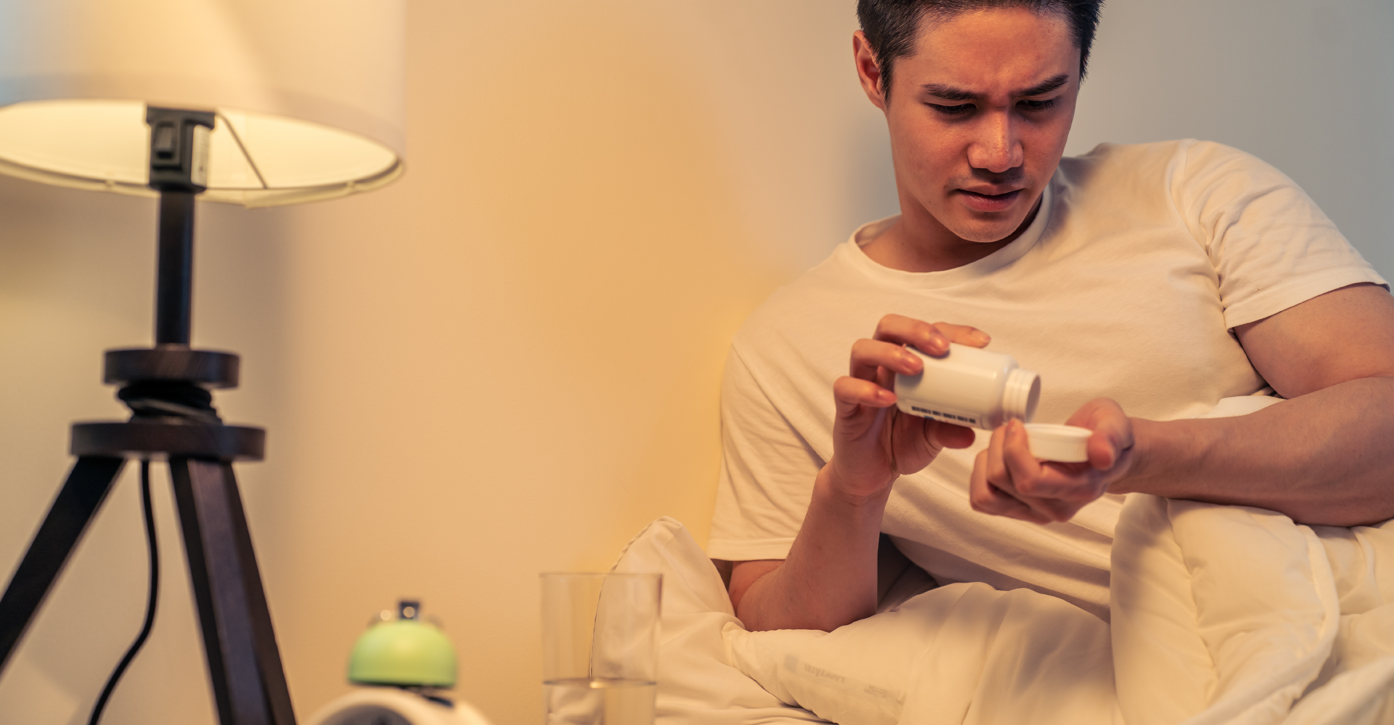 man taking multivitamins before bed