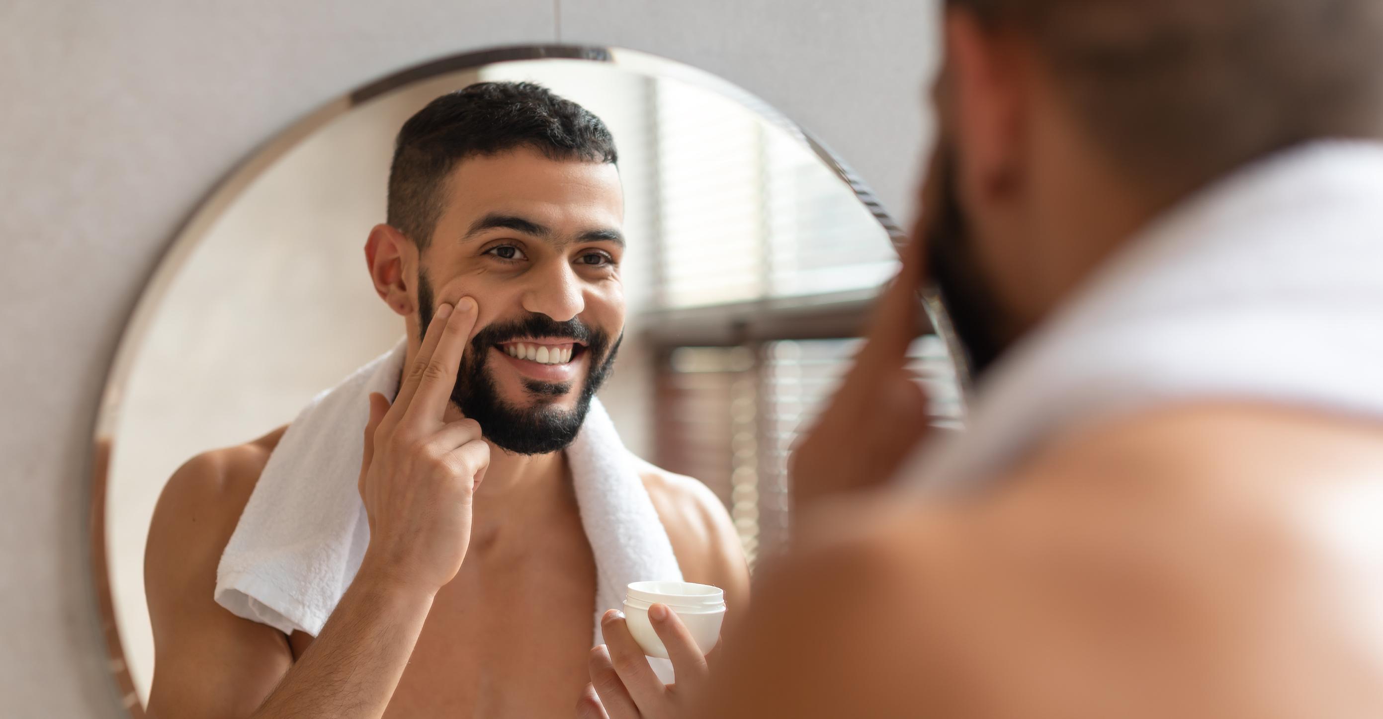 smiling man in a bathroom 