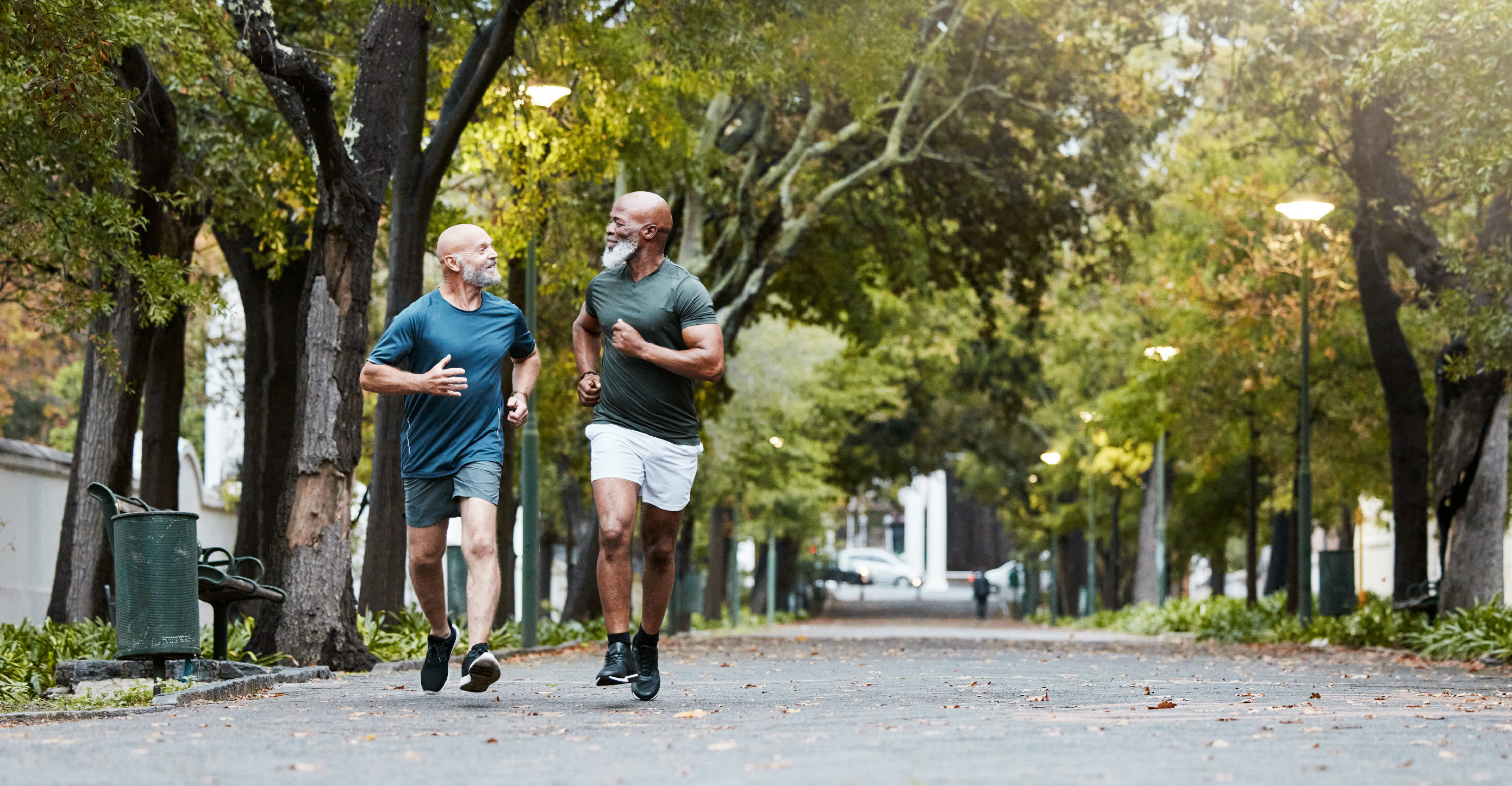 two senior men on a run outside 