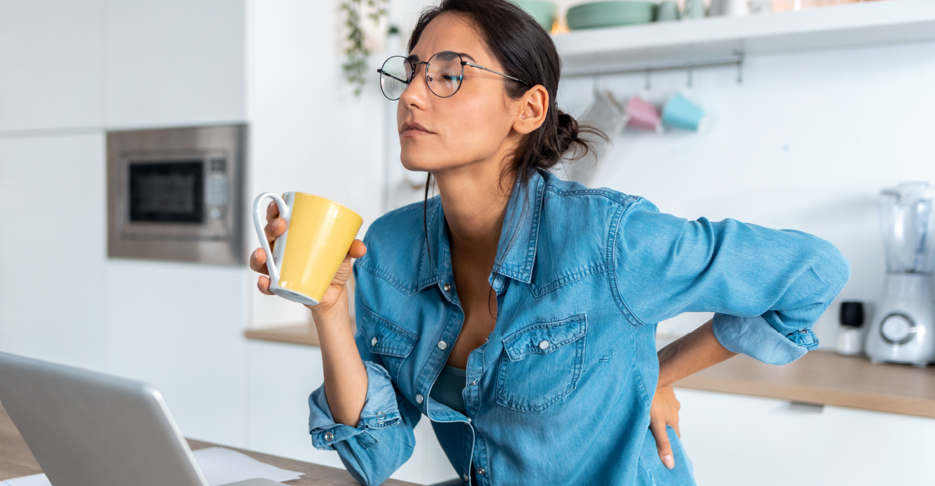 woman drinking coffee from a yellow mug