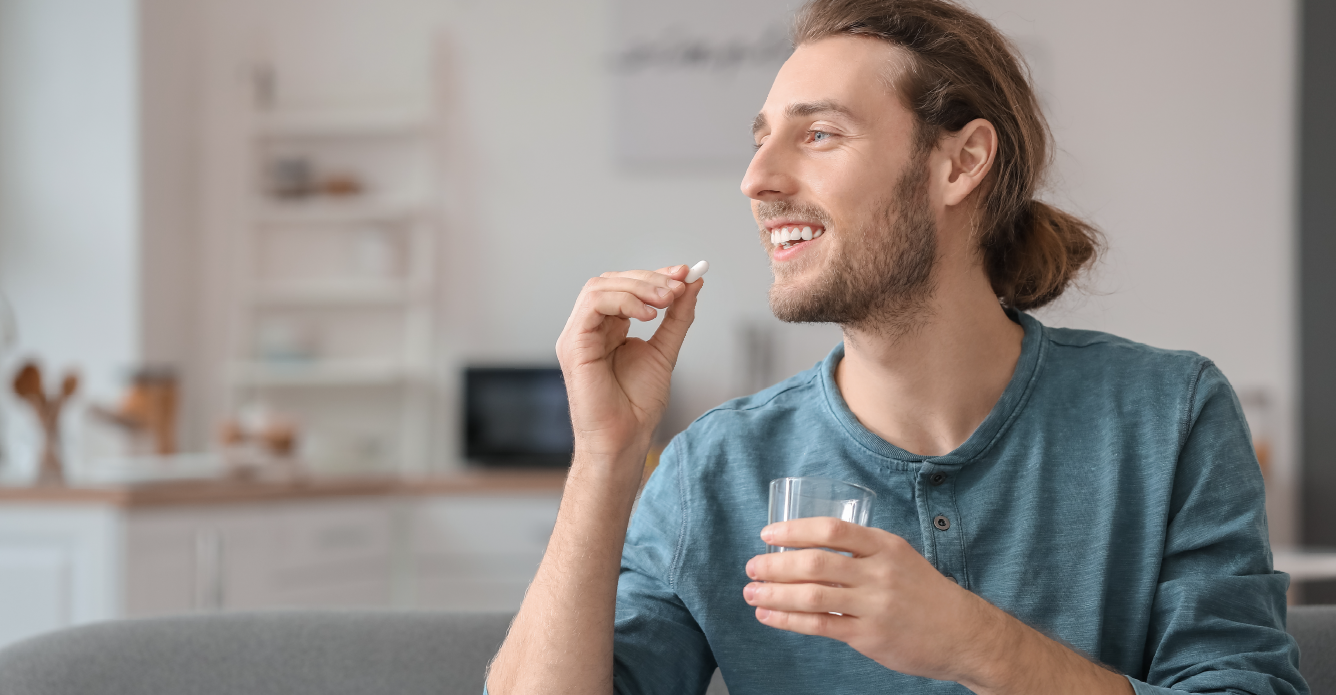 man taking supplement